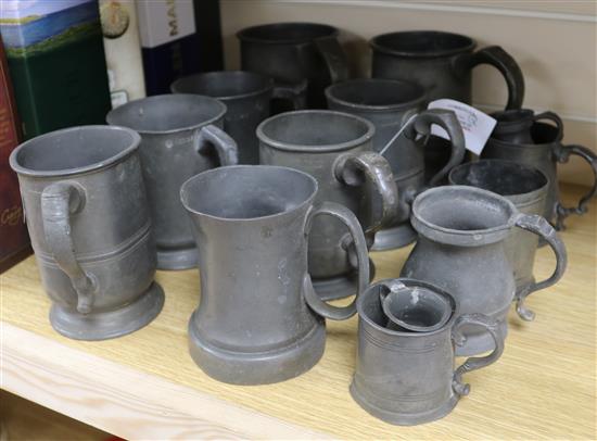 A collection of pewter measures, etc.